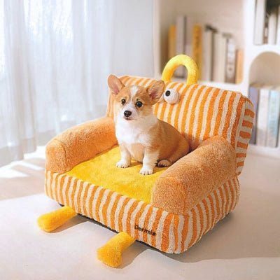 Chiot corgi assis sur un canapé lit chien Bibounet orange et douillet